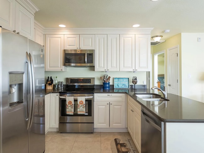 Building Photo - Stunning 2/1 available now at Waterside at Coqunia Key!