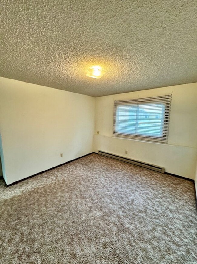 Building Photo - Charming 2-Bedroom Apartment Near MSU – Ca...