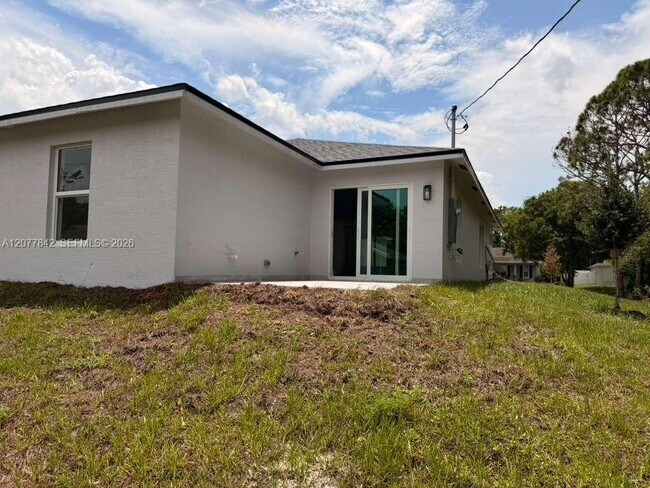 Building Photo - 8636 100th Ct