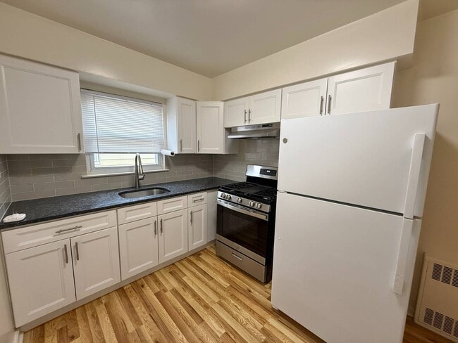 Building Photo - 203-16-203-42 42nd Ave