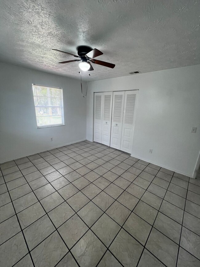 Building Photo - 3 BEDROOM 2 BATH CONVENIENTLY LOCATED WITH A TROPICAL OASIS IN THE BACK YARD!