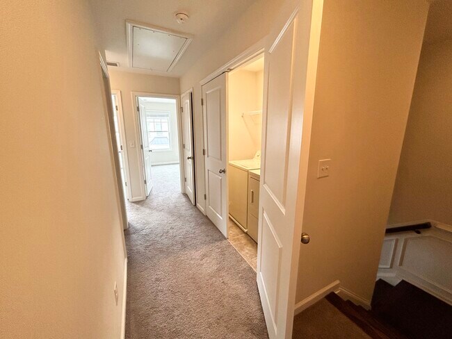 Upstairs Hallway w/ view of Washer/Dryer - 4697 Pine St SE