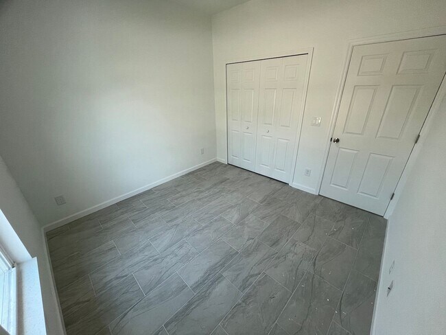 Building Photo - MODERN BRAND NEW 4BD/2BA RETREAT IN LEHIGH ACRES!