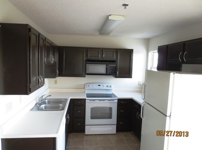 Kitchen with all appliances including oven, refrigerator and dishwasher - 111 Vixen Cir