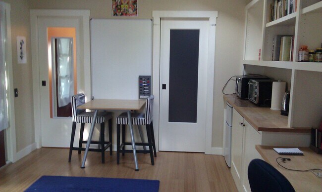 dining table, bathroom door on the left, walk-in closet on right - 134 S 12th St