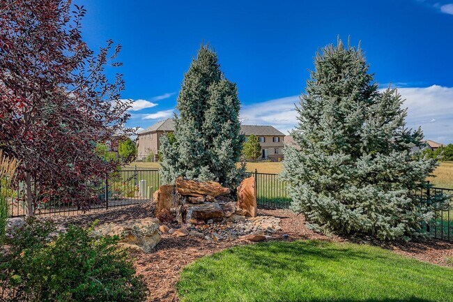 Building Photo - Beautifully maintained 5-bedroom home with a large finished basement, club access, and top-rated ...