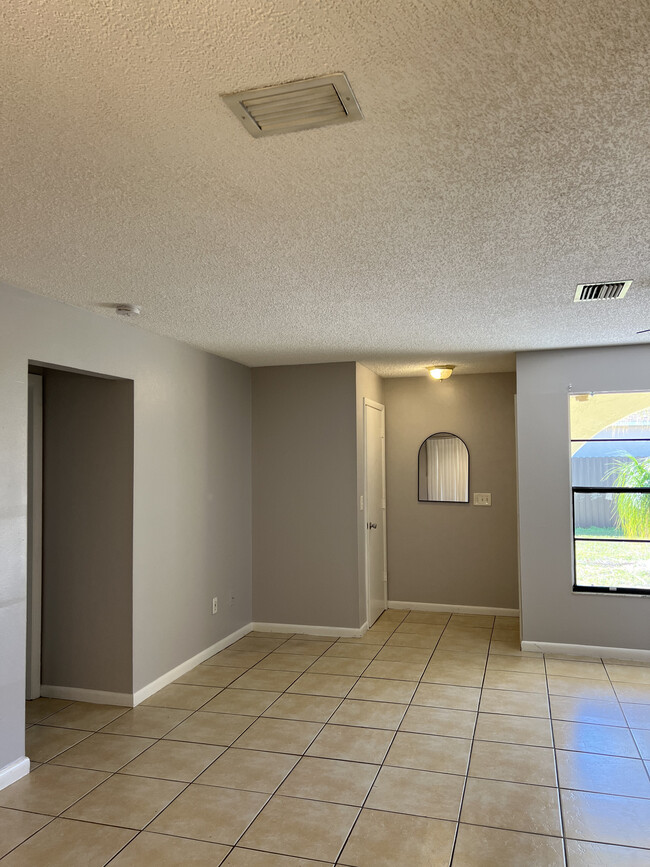 Entryway and living room space, with closet at entrance - 4629 SW 8th Pl