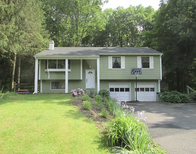 Front of house; lower unit enters through back via side pathway. - 9 Cardinal Dr