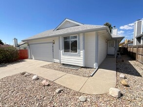 Building Photo - 4 Bedroom Home Available Near Research Pkwy & Scarborough Dr!