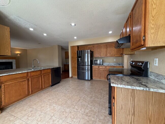 Building Photo - ~Available Now~  Beautiful Four Bedroom Home with Fireplace, Private Yard & Luxurious Primary Suite!