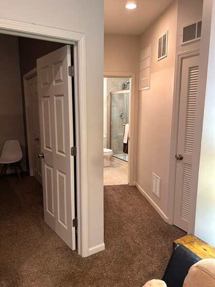 Hall to bathroom. - 616 Windham Ln