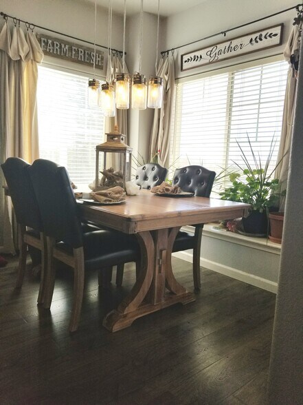Dining room. Lots of natural light! Door exits to patio with views of Pikes Peak. - 6964 ASH CREEK HTS