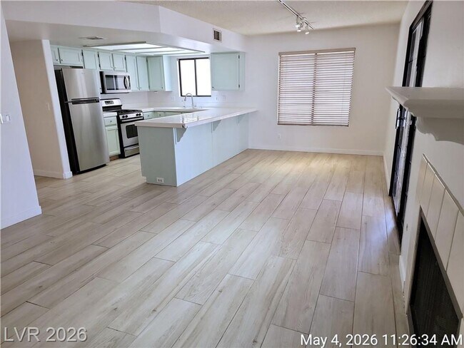 Building Photo - The Lakes Home with No Carpet, Fireplace & Covered Patio