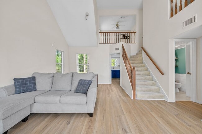 Building Photo - Spacious 3BR Retreat with Soaring Ceilings & Screened Porch