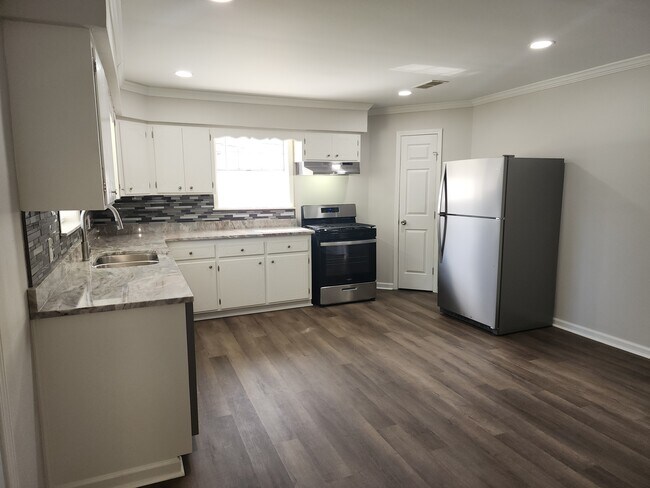 kitchen area with granite countertop and new stainless steel appliances - 1939 S Ringer Ave