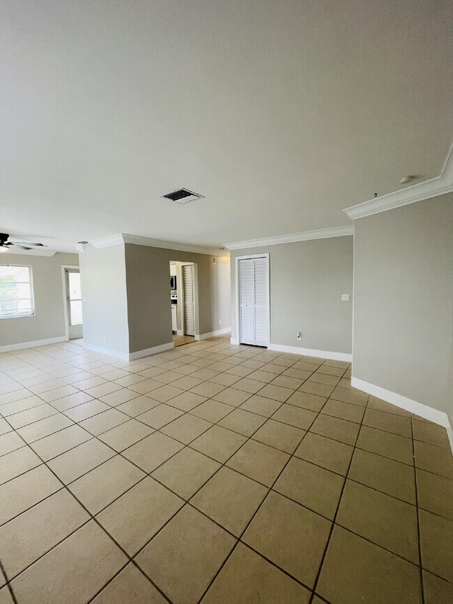 Building Photo - Updated 2-bedroom waterfront duplex with walk-in closets, enclosed Florida room, and canal views ...