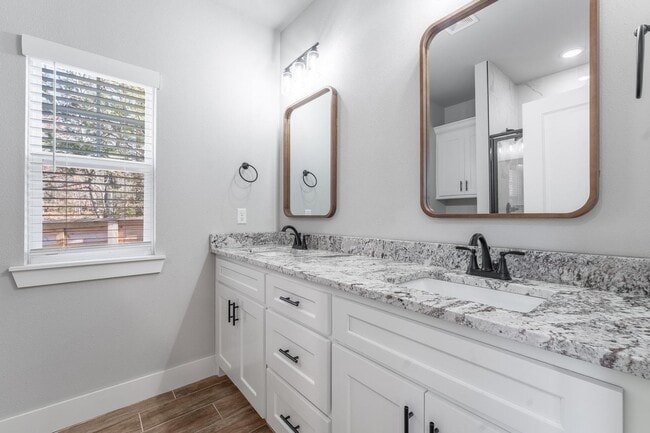 Building Photo - Welcome to this stunning 3-bedroom, 2-bathroom home that boasts a range of high-quality features ...