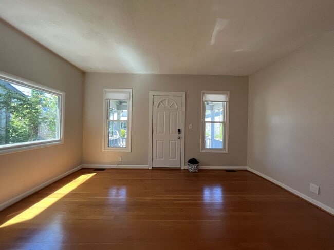 Building Photo - Charming Cottage with Hardwood Flooring, Modern Kitchen & Beautiful Outdoor Living Areas