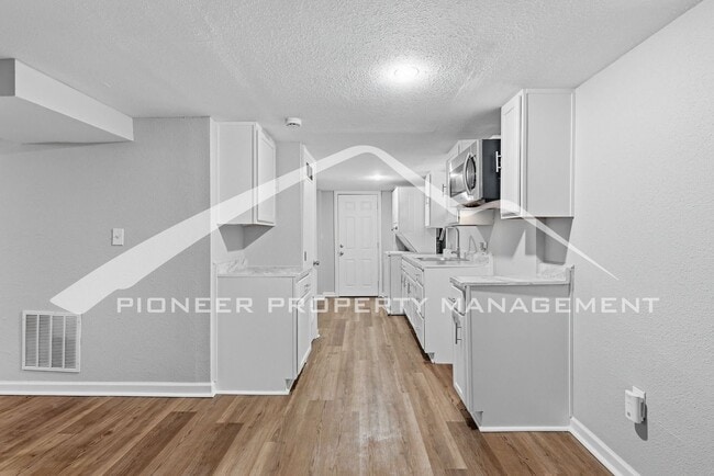 Building Photo - Spacious Home with 2 Kitchens and Central AC