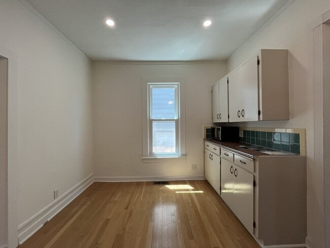 Building Photo - Charming Cottage with Hardwood Flooring, Modern Kitchen & Beautiful Outdoor Living Areas