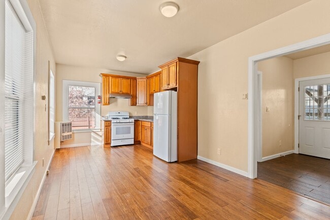 Building Photo - Utilities Included! Bright 1BD w/ Granite Kitchen & Plank Flooring