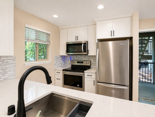 Building Photo - Modern Wooded Condo with Upgraded Kitchen & Private Deck
