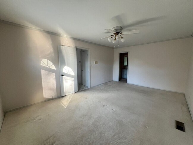 Building Photo - Step into this inviting, sunlit home where space and comfort blend seamlessly