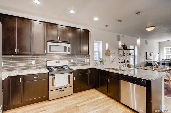 Building Photo - "Charming 2-Bed, 2-Bath Home with Gleaming Hardwood Floors in Vibrant Denver!"