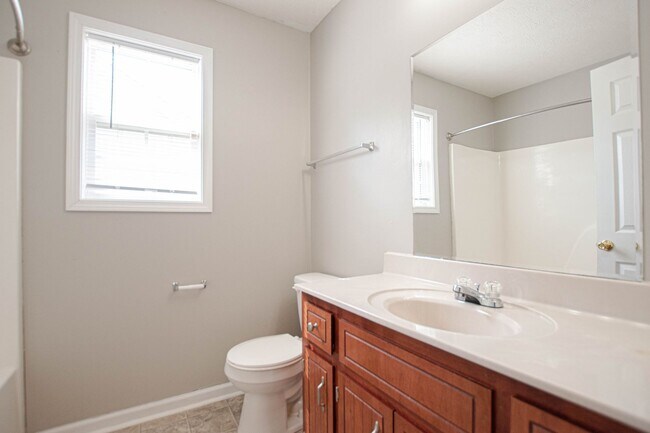 Building Photo - Pet Friendly with Fenced Yard!