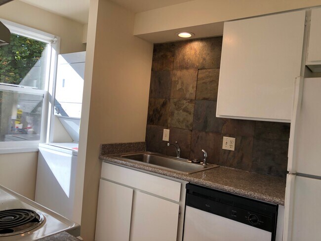 large stack washer dryer in unit (similar shown) - 11308 E Mission Ave