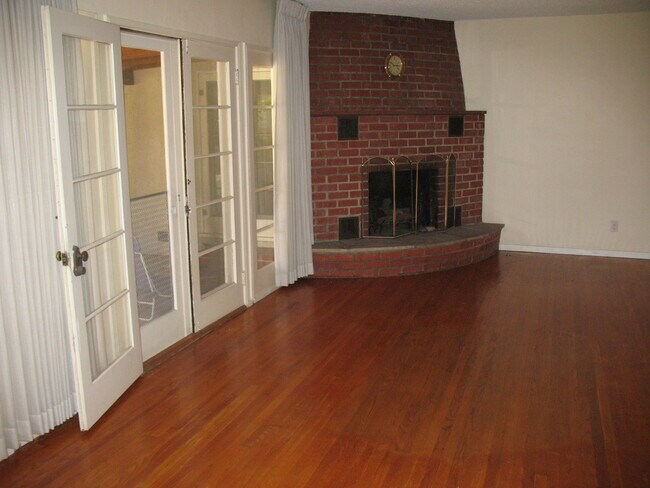 Living Room / French Doors to covered backyard patio - 3121 W Wyoming Ave