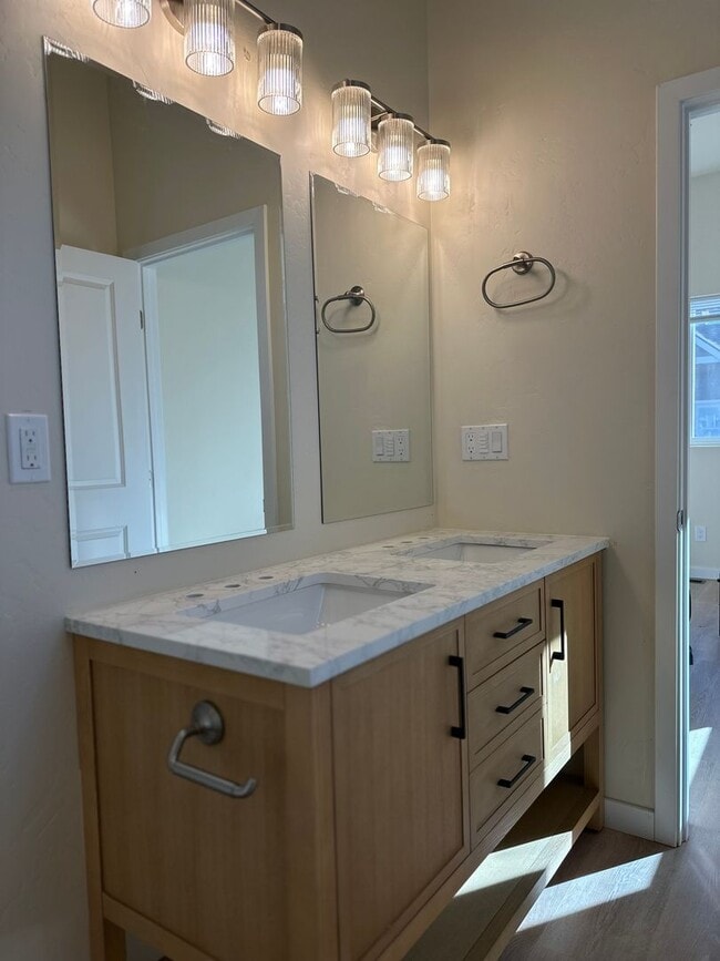 Building Photo - Bright & New 2 Bed / 2 Bath with Vaulted Ceilings & Covered Parking!