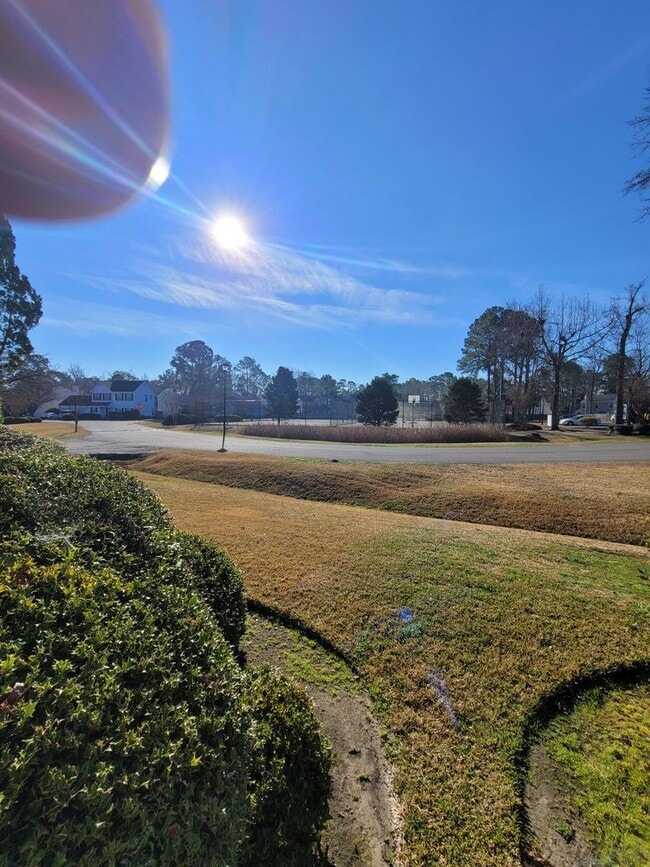 Building Photo - Located in Caneel Cove this 2 bed 2 bath townhome features hardwood floors throughout ,