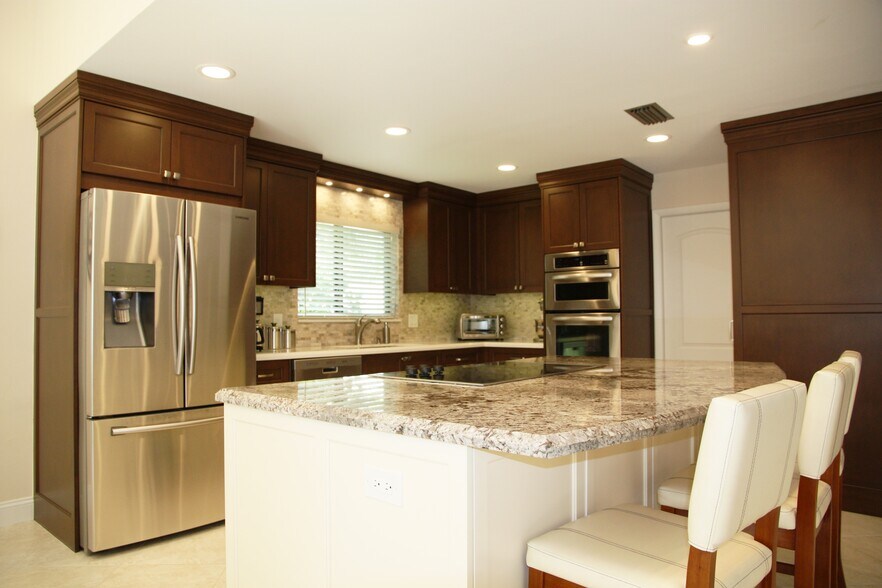 Beautifully updated kitchen with wood cabinets - 2662 NW 42nd St