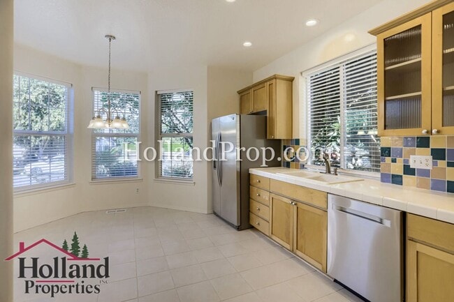 Building Photo - Charming 3-Bedroom Home with Wood Floors, Gas Fireplace & Private Patio