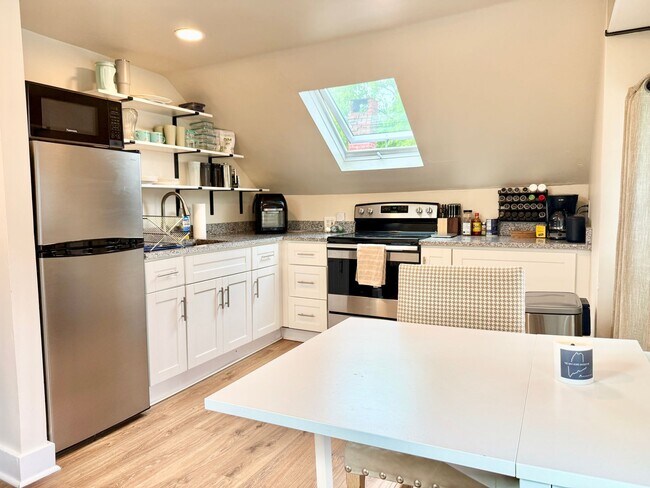 Building Photo - All Inclusive West End Condo-Fully Furnished with Parking!