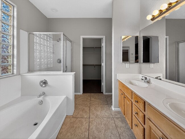 Building Photo - Single-level 4 bed, 2 bath home with tandem 3-car garage and RV gate.
