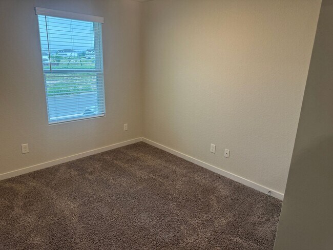 Building Photo - Stylish, Spacious & Close to It All – Your Ideal Townhome Awaits!