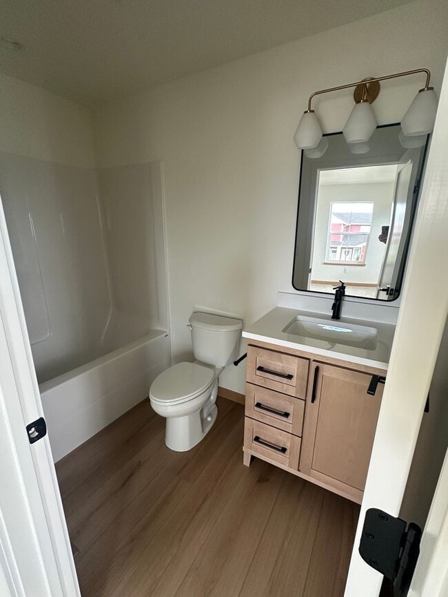 Building Photo - New 3 bed 3 bath w/garage for Rent - Kalispell Townhouse