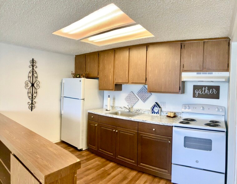 White appliances included - Oakland Hills | Single Story Apartment Homes