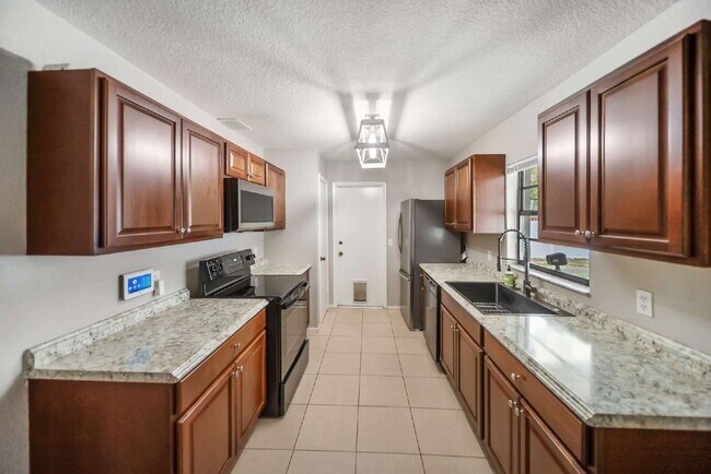 Building Photo - Heated Pool. Premium Upgrades. Fully Renov...