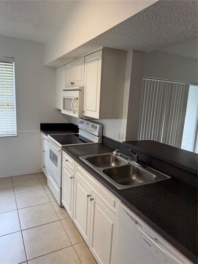 Building Photo - $2,400MONTHLY;9615 NW 1ST CT #10-301 PEMBR...
