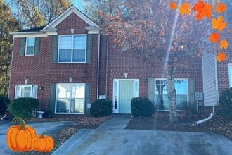 Building Photo - Welcome to this charming brick townhome in...