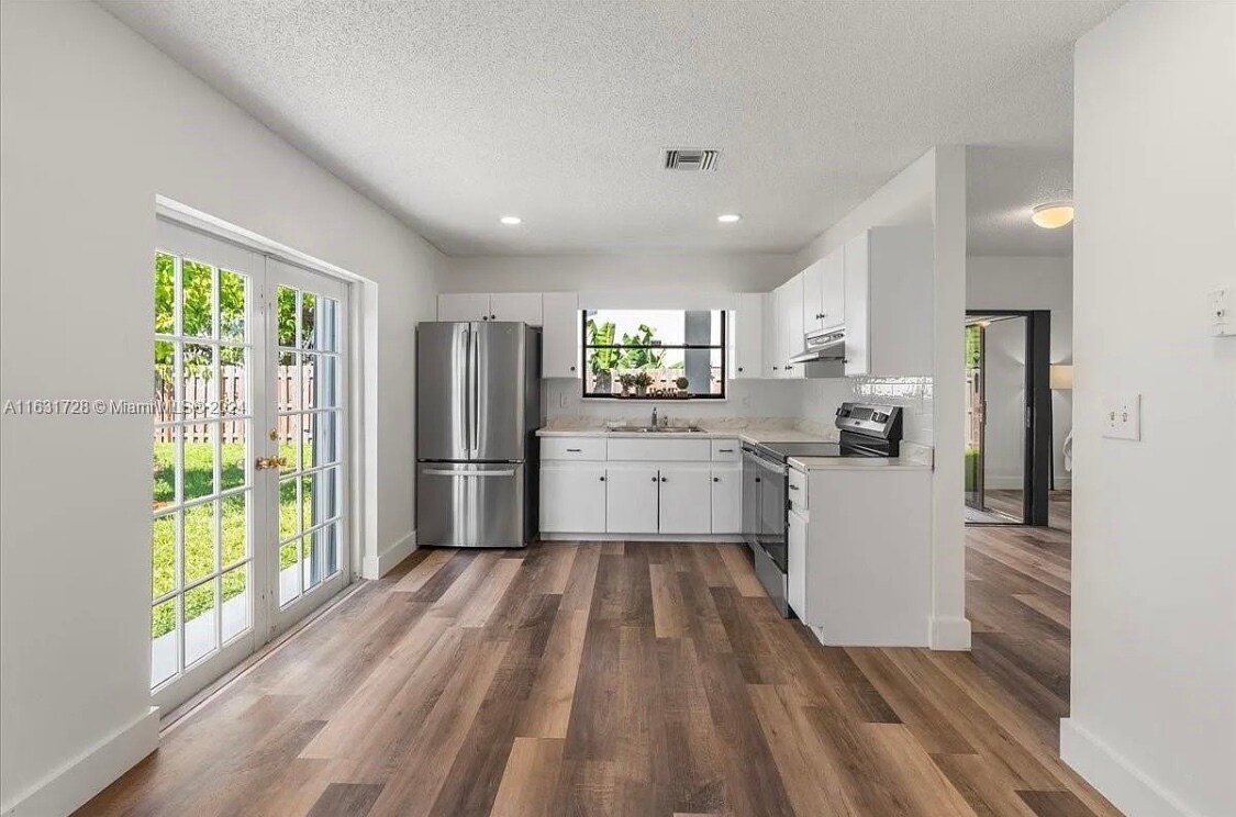 Shared kitchen with all new stainless steel appliances. - 2512 SW 113th Ct