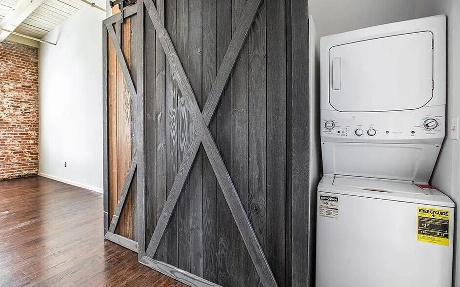 Sliding barn doors to stacked laundry unit and custom closet. - 320 M L K Jr Dr SE
