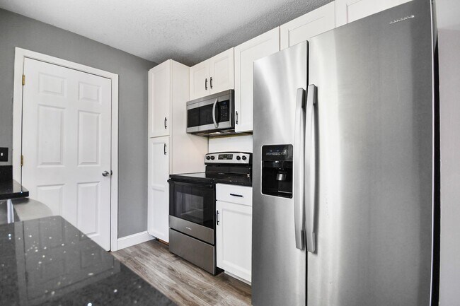 Building Photo - Pet Friendly Three Bedroom with Basement!