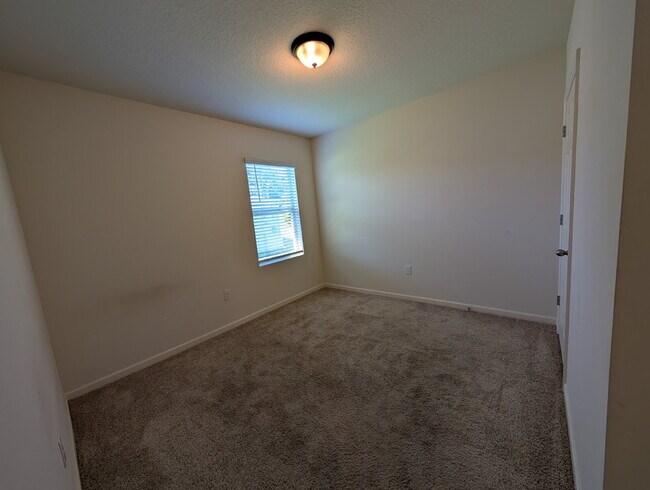 Building Photo - Modern 4-Bedroom Home with Large Backyard in Quiet SW Palm Bay – Available Mid-June