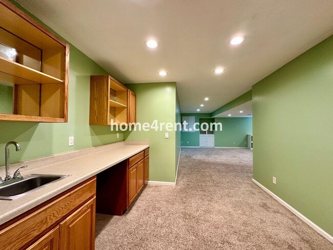 Building Photo - Beautiful Four-Bedroom Home with Three Car Garage, Wood Floors, Finished Basement and a Fenced Ya...
