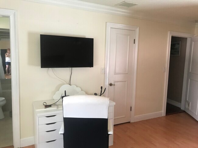 desk with smart tV - 600 NW 7th Ave