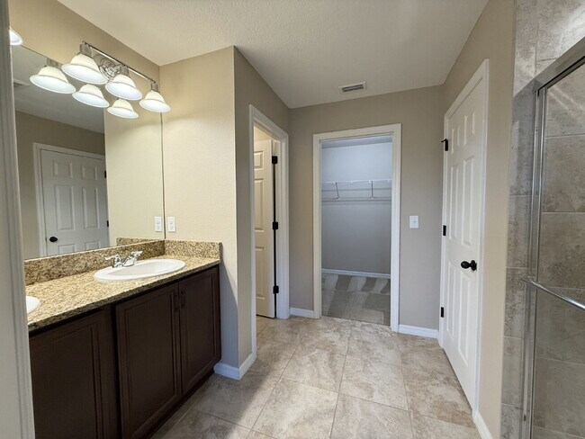 Building Photo - Spacious 4-Bedroom Retreat with additional office/den in the Heart of Trinity!